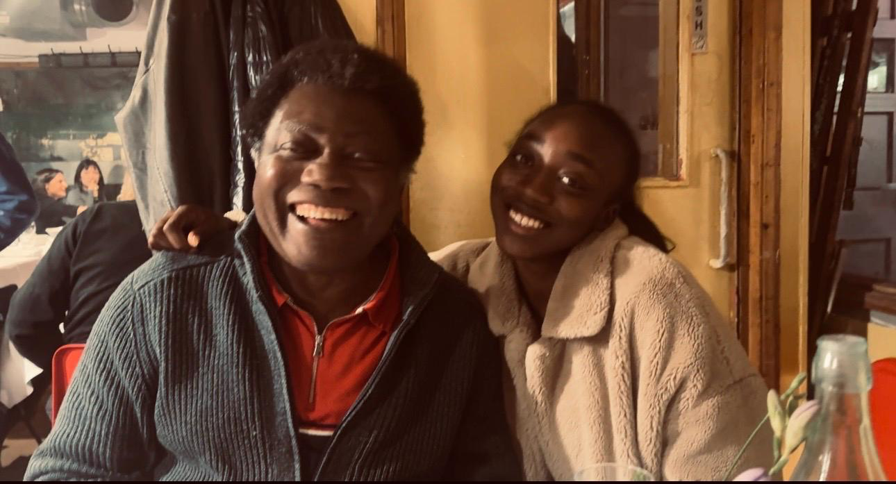 A father and daughter laughing together